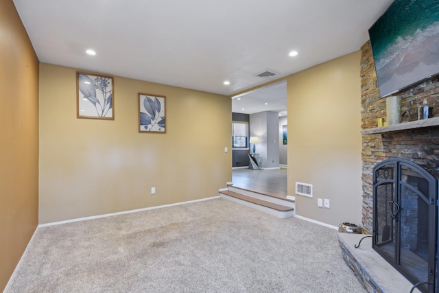 unfurnished living room featuring recessed lighting, carpet flooring, visible vents, and baseboards