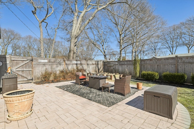 view of patio with a fenced backyard and a gate