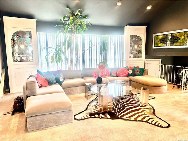 living room with lofted ceiling and recessed lighting