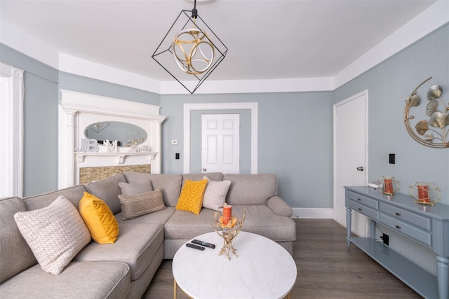 living room featuring dark wood-style flooring and a notable chandelier