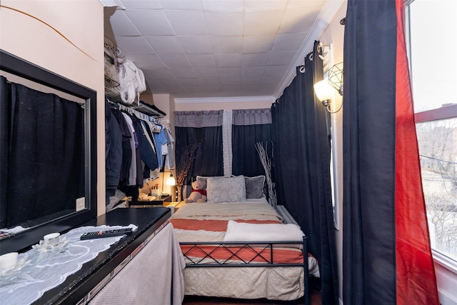 bedroom with ornamental molding