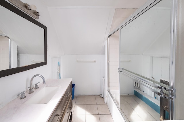 full bathroom featuring radiator heating unit, a shower with shower door, vaulted ceiling, vanity, and tile patterned floors