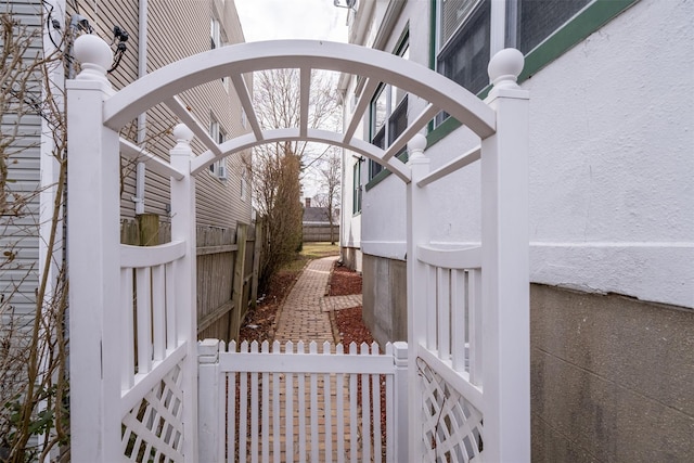 view of gate featuring fence