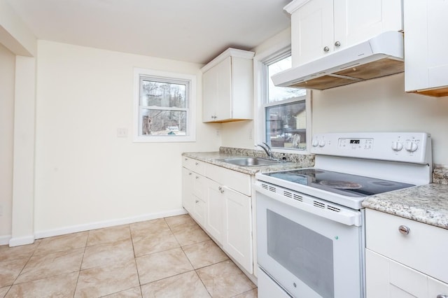 kitchen with electric stove, light tile patterned flooring, a sink, white cabinets, and under cabinet range hood