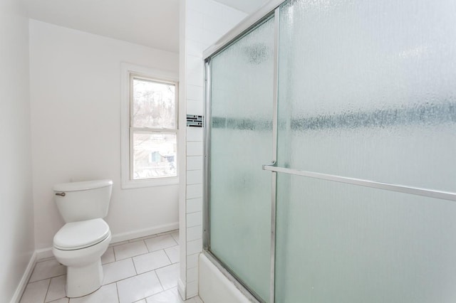 full bath featuring baseboards, toilet, and tile patterned floors