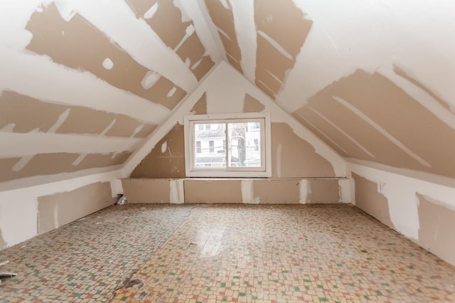 bonus room featuring lofted ceiling