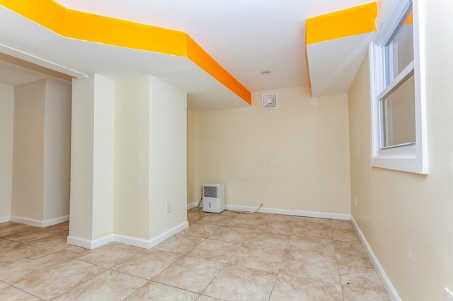 tiled empty room with baseboards