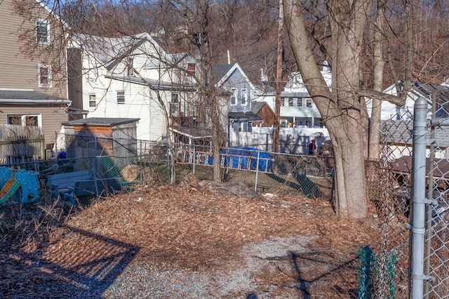 view of yard with a residential view and fence