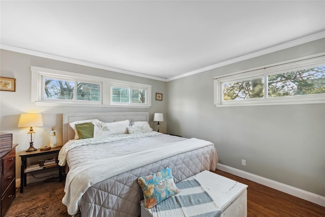 bedroom featuring baseboards, wood finished floors, and ornamental molding