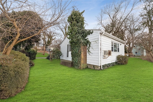 view of property exterior featuring a lawn and a wall unit AC