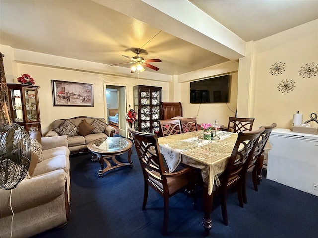 dining space featuring carpet and a ceiling fan