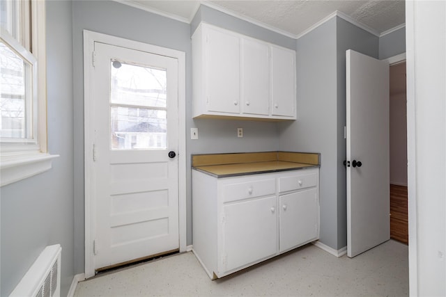 interior space featuring visible vents and crown molding