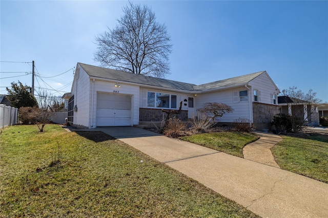 ranch-style house featuring an attached garage, driveway, fence, and a front yard