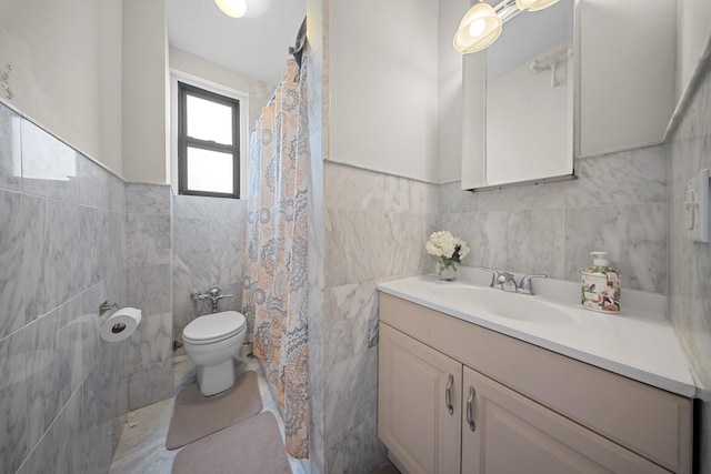 bathroom featuring curtained shower, toilet, tile walls, and vanity