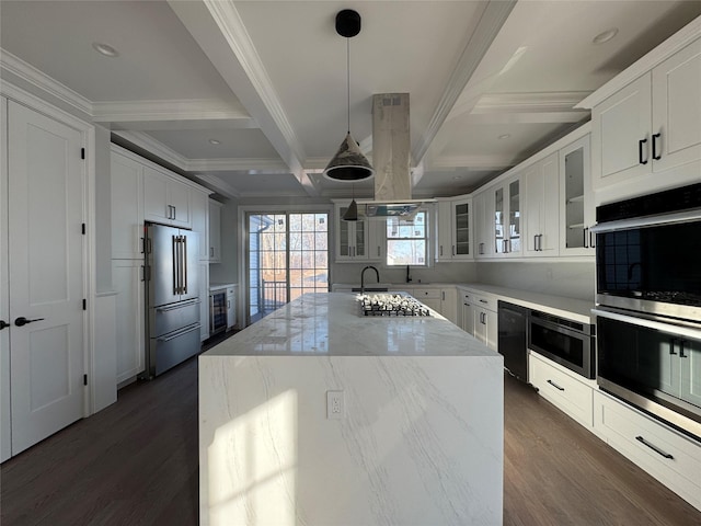 kitchen featuring beverage cooler, coffered ceiling, a kitchen island, beamed ceiling, and stainless steel appliances