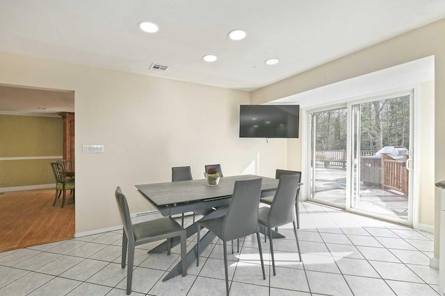 dining space featuring baseboards, light tile patterned flooring, visible vents, and recessed lighting