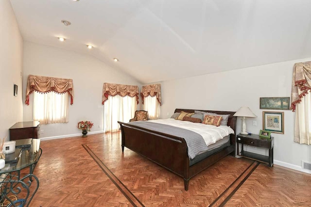 bedroom featuring high vaulted ceiling, visible vents, and baseboards