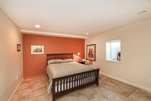 bedroom with recessed lighting and baseboards