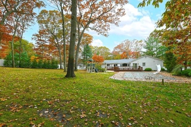 view of yard featuring a wooden deck