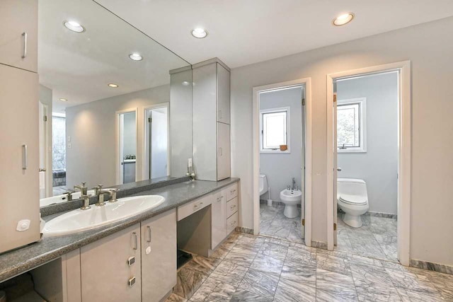 4 Hunting Hill Dr, Dix Hills, NY 11746 - full bathroom featuring a bidet, vanity, marble finish flooring, and recessed lighting