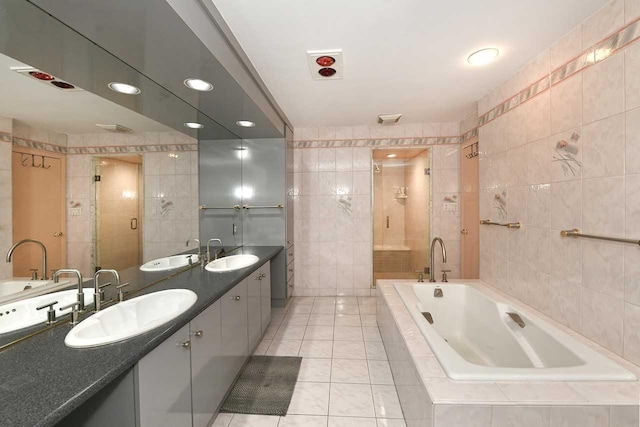 4 Hunting Hill Dr, Dix Hills, NY 11746 - full bath with tile walls, a bath, a stall shower, double vanity, and tile patterned floors