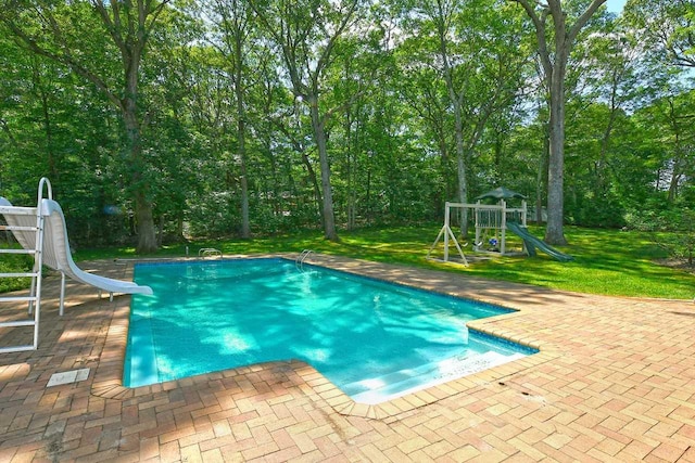 4 Hunting Hill Dr, Dix Hills, NY 11746 - outdoor pool featuring a water slide, a patio, a yard, and a playground