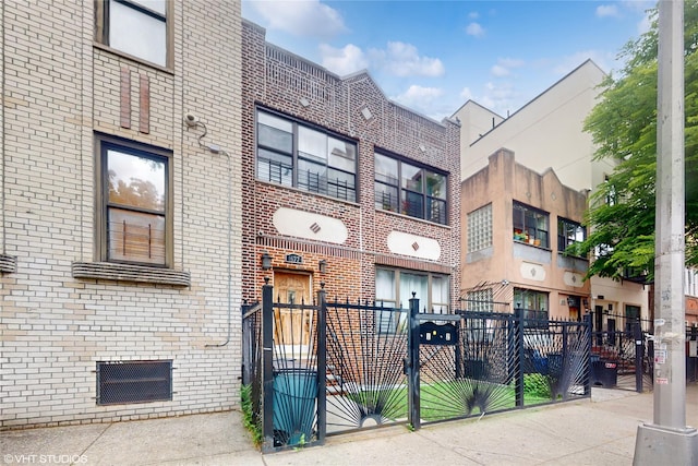 view of building exterior with a fenced front yard