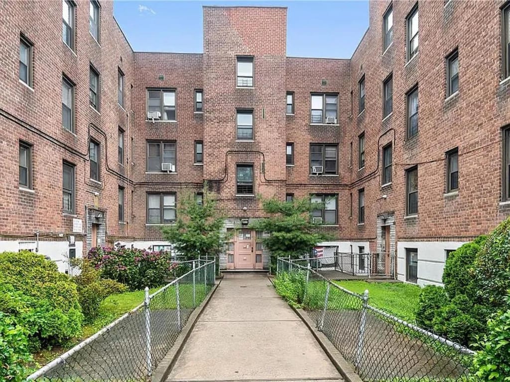 view of property featuring fence