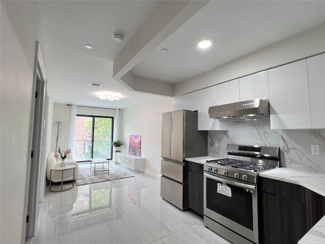 kitchen with appliances with stainless steel finishes, modern cabinets, white cabinets, and under cabinet range hood