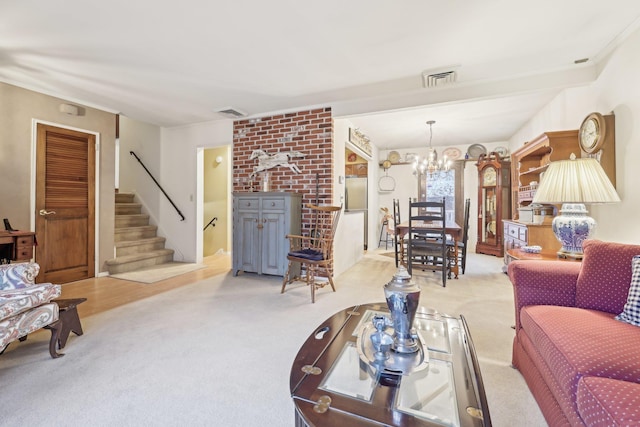 living room featuring stairs, carpet, visible vents, and a notable chandelier