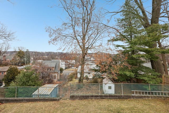 view of yard featuring fence private yard and a residential view