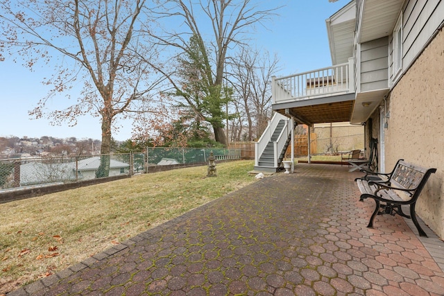 view of patio / terrace with a fenced backyard, stairway, and a wooden deck