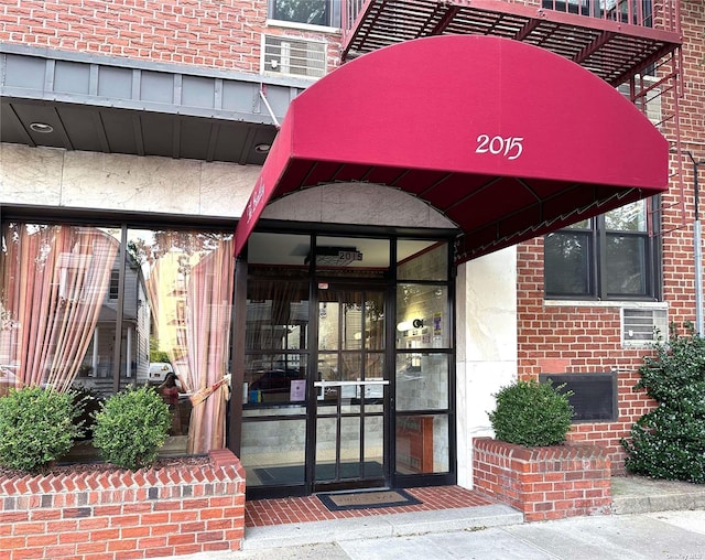 entrance to property with brick siding