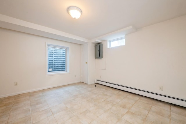 basement with a baseboard radiator, electric panel, and baseboards