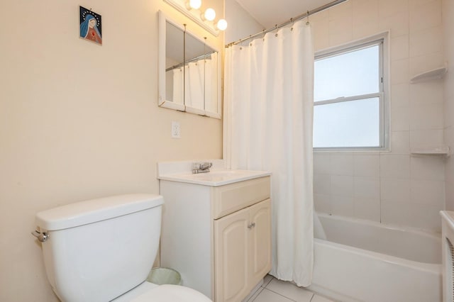 bathroom with tile patterned flooring, vanity, toilet, and shower / bath combo with shower curtain