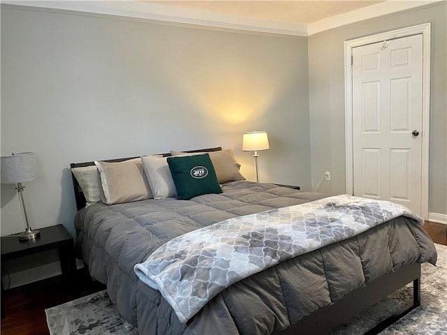 bedroom featuring wood finished floors