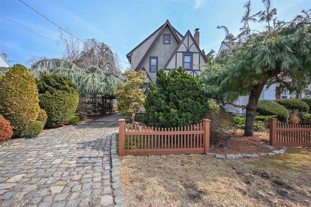 tudor home with fence