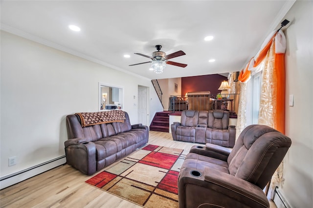 living area featuring stairway, crown molding, a baseboard heating unit, and wood finished floors