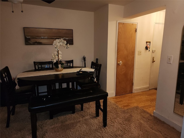 dining area with wood finished floors