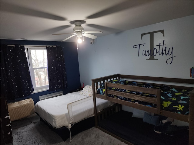 bedroom featuring radiator and a ceiling fan