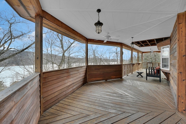 wooden terrace featuring a ceiling fan