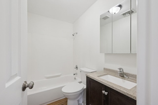 bathroom with bathtub / shower combination, visible vents, vanity, and toilet