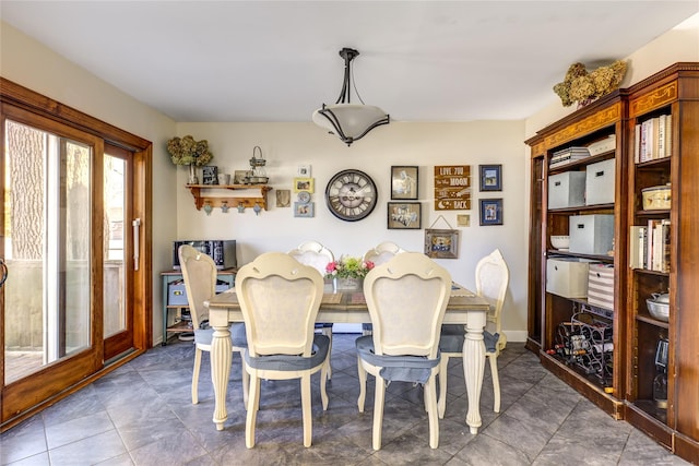 dining room featuring baseboards