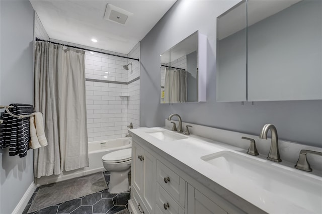 full bathroom with double vanity, a sink, toilet, and shower / tub combo with curtain