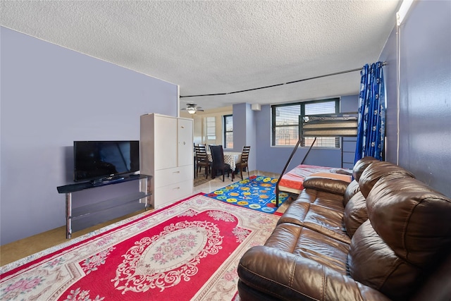 carpeted living area with a textured ceiling