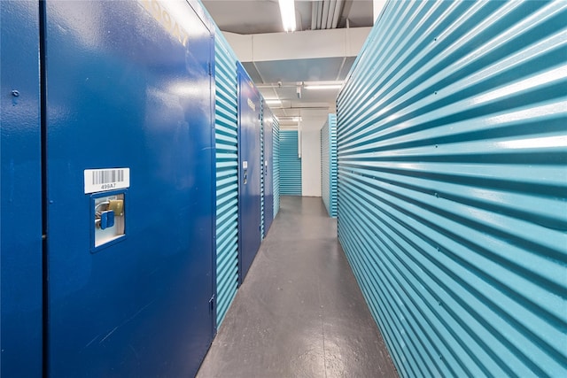 hallway featuring finished concrete flooring