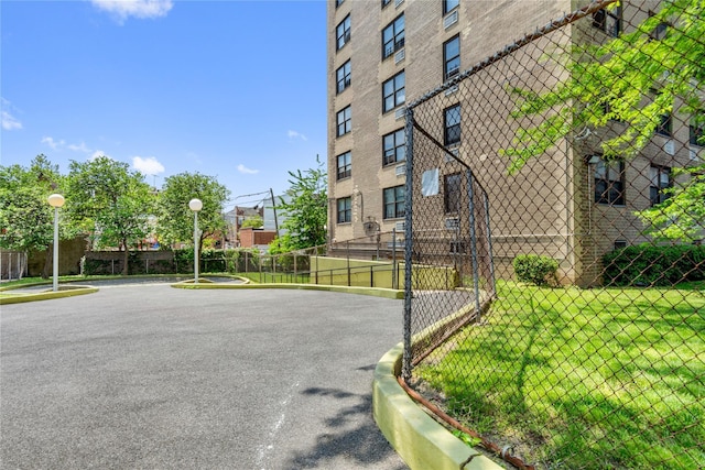 view of building exterior with fence