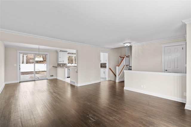 unfurnished living room with visible vents, baseboards, stairs, ornamental molding, and dark wood finished floors