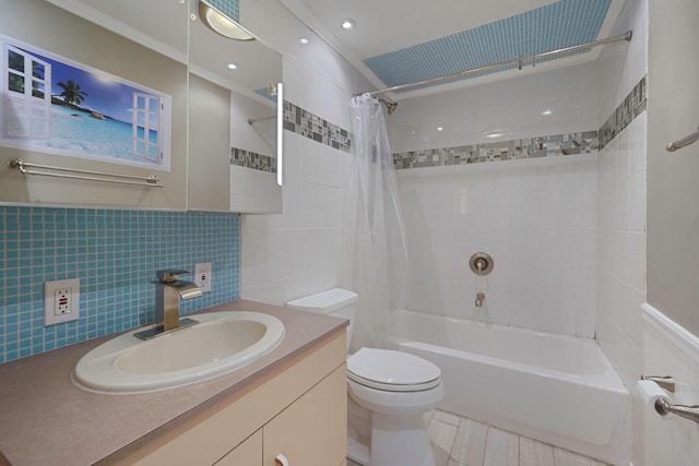 bathroom featuring shower / tub combo, toilet, crown molding, vanity, and tile walls