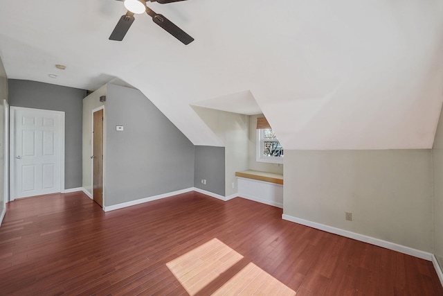 bonus room featuring ceiling fan, vaulted ceiling, baseboards, and wood finished floors